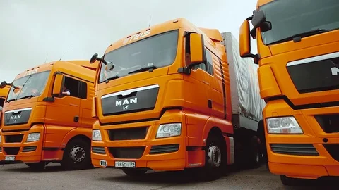 Driver starts motion of the cargo TIR transportation truck from parking lot Stock Footage 83417995
