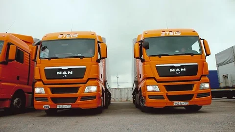 Driver starts motion of the cargo TIR transportation truck from parking lot Stock Footage 83418037