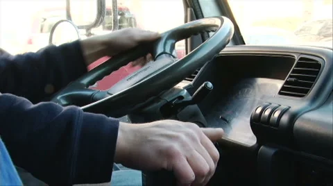 Driver steering a truck Stock Footage