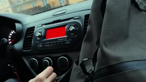 The driver studies the dashboard in the car Stock Footage 253817916