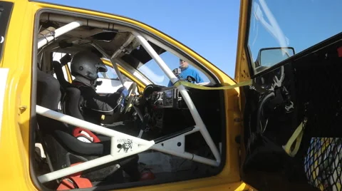 Driver takes off his gloves and helmet after arrival Stock Footage 48594428