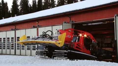 Driver takes snowcat machine out of the garage in Trysil, Norway. Stock Footage 61471314