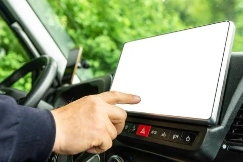 Driver touching blank multimedia screen in car 스톡 사진