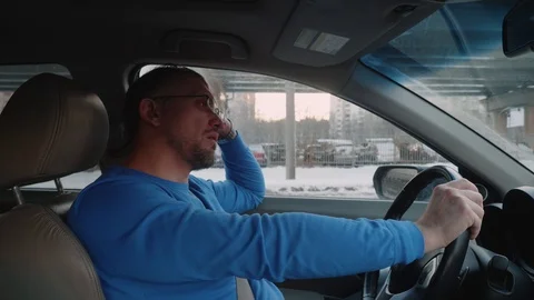 Driver is in traffic jam moving and stopping and waits patiently. Sunset in Stock Footage 109434797