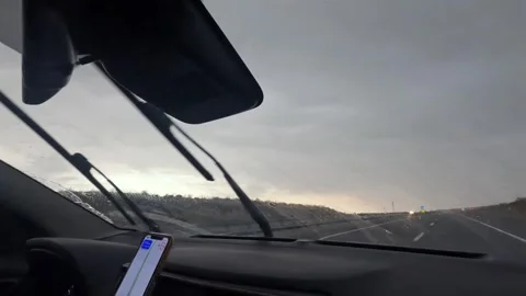 Driver travels through heavy rain in front interior view Stock Footage 343805227