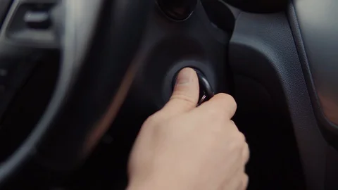 Driver is turning ignition key in automobile, close-up of hand Stock Footage 103281771