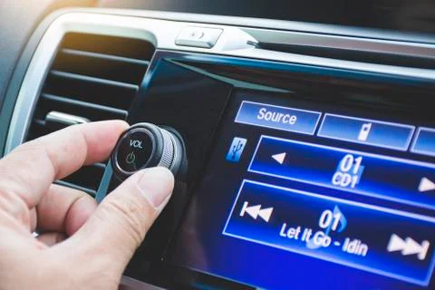 Driver turning volume button Stock Photos