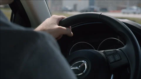 Driver turns the steering wheel on the roundabout Stock Footage 40737186