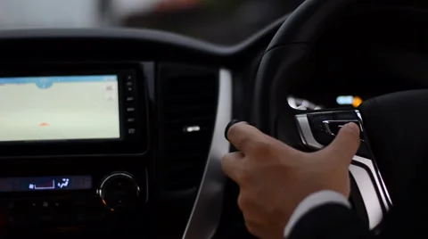 Driver use function button on steering wheel to control navigator Stock Footage 68677729