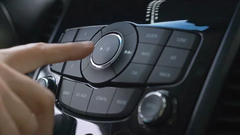 Driver using car audio stereo system Stock Footage 95844930