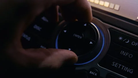 Driver using car infotainment system control knob Video stock 325070556