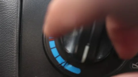 Driver is using heat switch in the car Stock Footage 48844890