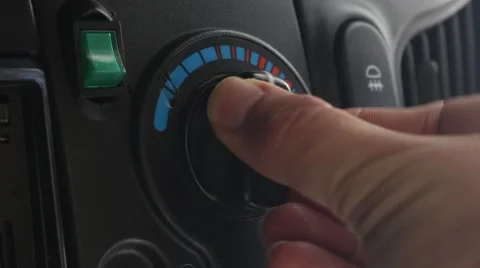 Driver is using heat switch in the car Stock Footage 48844891