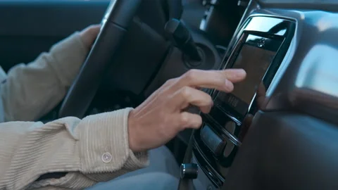 Driver using navigation system on touch screen in car Stock Footage 318917440