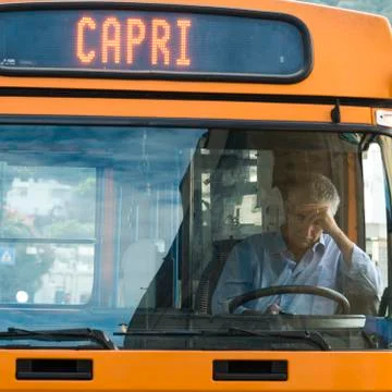 Driver using phone in bus, Capri, Campania, Italy Stock Photos