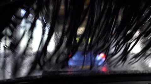 Driver view looking out through the windshield while going through an indoor Stock Footage 247274127