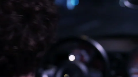 Driver waiting at traffic light in the night Stock Footage 41545646