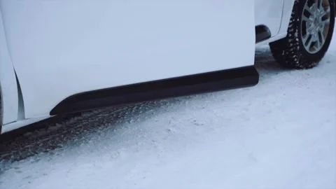 The driver of a white minivan gets out of the car Stock Footage 170654424