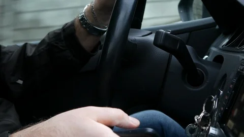 The driver writes in the phone on the go, close-up Stock Footage 86067866