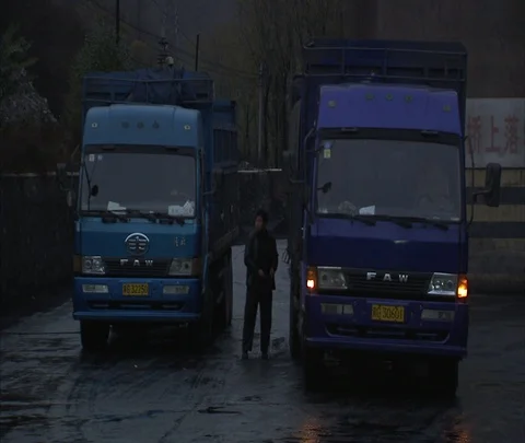 Drivers of coal trucks get out and talk with each other Stock Footage 86744919
