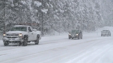 DRIVERS COMMUTERS IN HEAVY SNOW STORM CALIFORNIA SIERRAS TAHOE Stock Footage 34536287