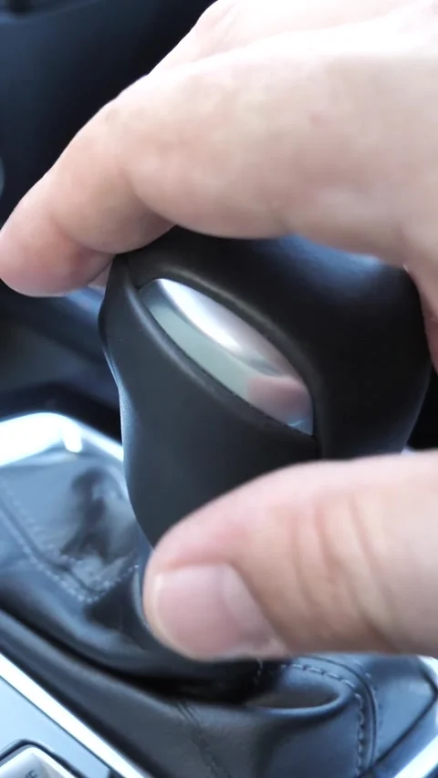 The driver's hand changes gears of the gearbox in manual mode Stock Footage 266913826