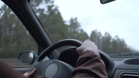 The driver's hand controls the car. Stock Footage 107743718
