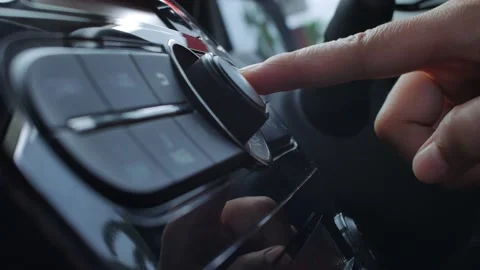 Driver's Hand Press Button on Car Radio Stock Footage 141591431