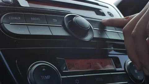 Driver's Hand Press Button on Car Radio Stock Footage 141591598