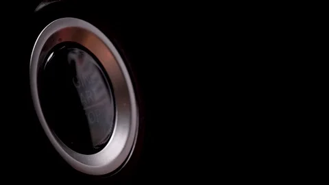 The driver's hand is pressing the car start button. Concept of transportation an Stock Footage 164514201