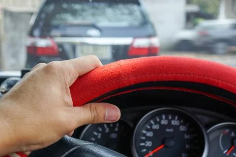 Driver's hand on the steering wheel inside of a pickup truck Stock Photos