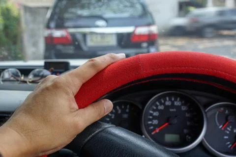 Driver's hand on the steering wheel inside of a pickup truck Stock Photos