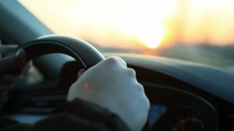 The driver's hands hold the steering wheel when driving a car in winter, close Stock Footage 158356680