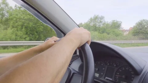 Driver's hands on the steering wheel close-up. Video stock 76514237