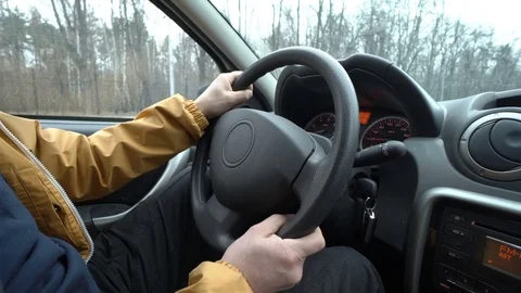 Driver's hands on steering wheel Stock Footage 75040595