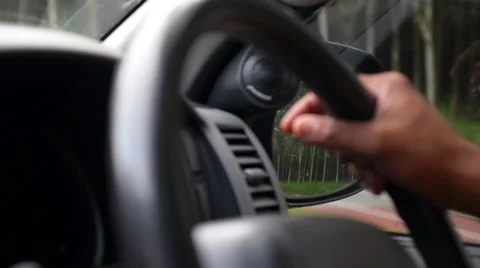 Driver's Hands on Steering Wheel Inside of a Car Stock Footage 59147849