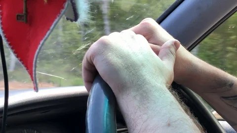 Driver's hands on the steering wheel while driving the car Stock Footage 124791503