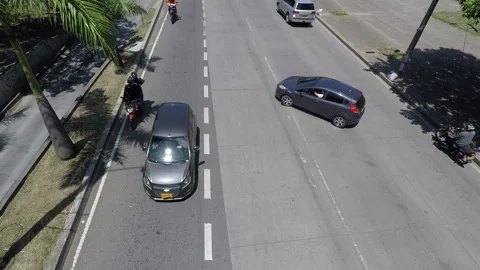 Drivers make an illegal u turn and drive the wrong way - Colombia 2021 Video stock 157514252