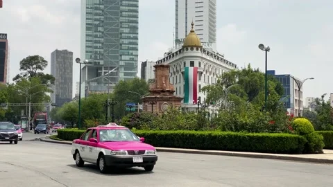 Drivers navigate by Glorieta Colon in Paseo de la Reforma ave, Mexico City, 4K Stock Footage 160368429