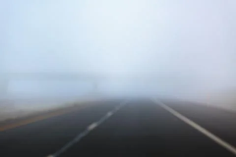 Driver's perspective in fog on Interstate 90 in a rural area. Fotos de archivo