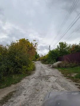 Drivers perspective from inside a car on a sunny day, hand on steering whee.. Stock Photos