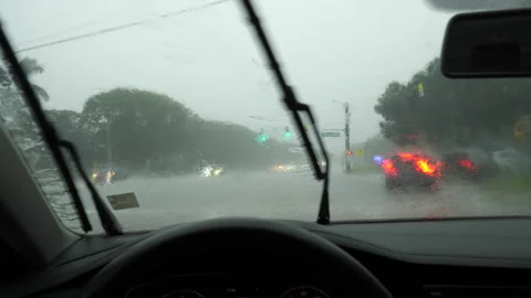 Driver's Point of View through Windshield Traveling in Rain Stock Footage 284176681
