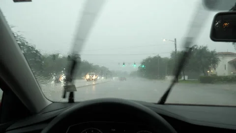 Driver's Point of View through Windshield Turning Left in Rain Stock Footage 284176749