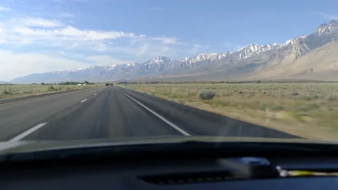 Driver's point of view in vehicle rearview mirror view view empty road Stock Footage 232158680