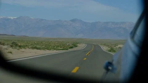 Driver's point of view in vehicle rearview mirror view view empty road Stock Footage 232158763