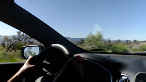 Driver's point of view in vehicle rearview mirror view view empty road Stock Footage 232168186