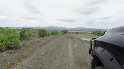 Driver's side POV shot of pickup on  a desert road in Nevada Stock Footage 151350693