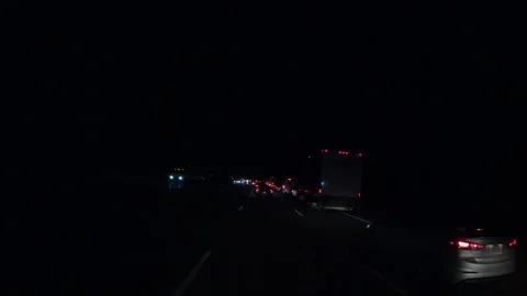 Drivers stuck in highway traffic jam at night Видео 331291129