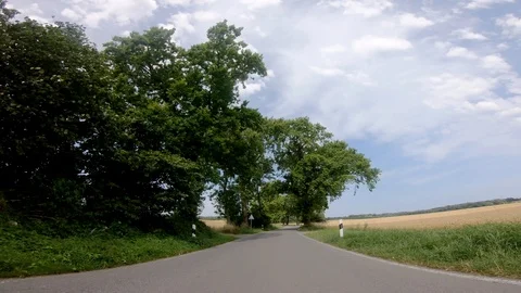 Drivers view (On-board camera) Car on a rural road in the northern germany near Video stock 115886562