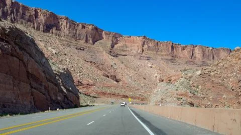 Driver's view of the highway through spectacular scenery in Utah Stock Photos